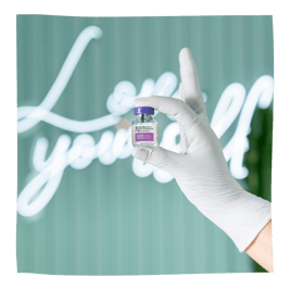 botox bottle in front of love yourself sign